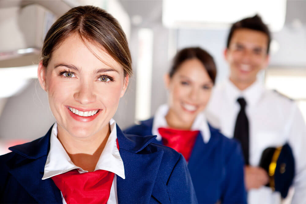 Smiling airline employees.